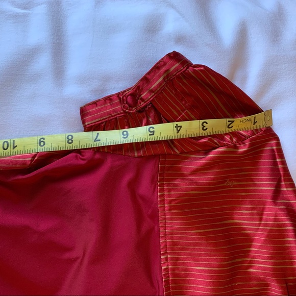 Red satin feel too with gold print in small and cones with optional belt. - Picture 6 of 12
